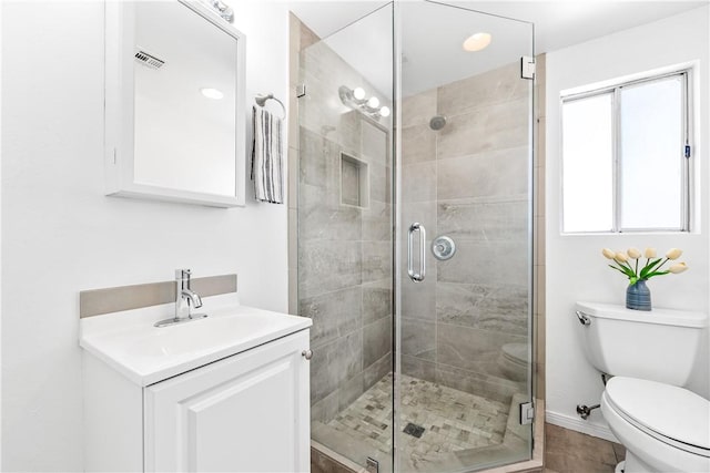 10022 Bismark Dr, Huntington Beach, CA 92646 - full bathroom featuring visible vents, toilet, a stall shower, and vanity