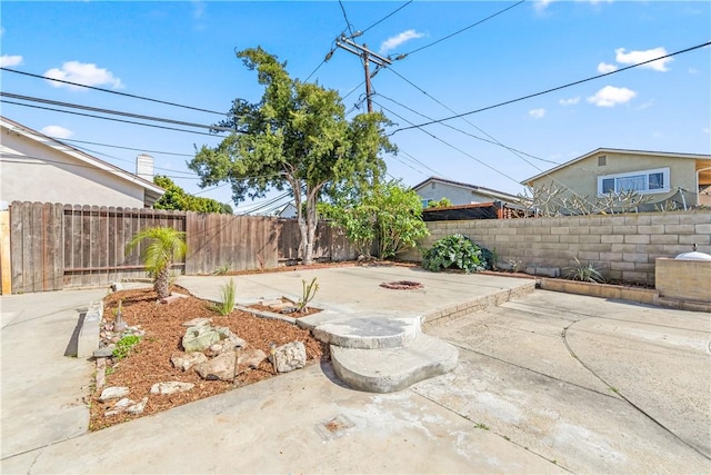 10022 Bismark Dr, Huntington Beach, CA 92646 - view of patio / terrace with an outdoor fire pit and a fenced backyard