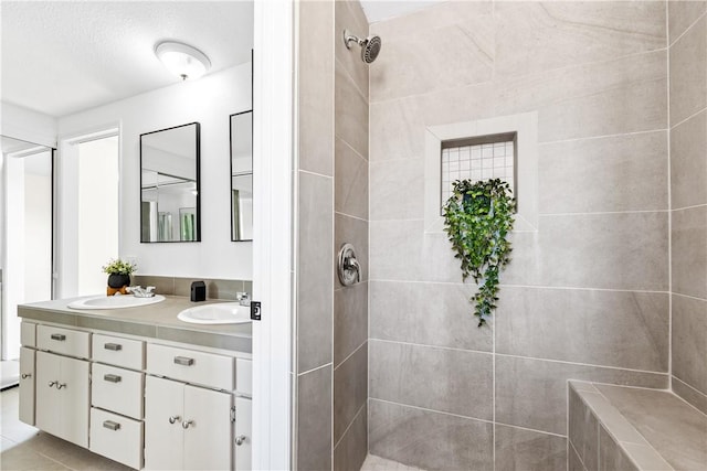 10022 Bismark Dr, Huntington Beach, CA 92646 - bathroom featuring double vanity, a sink, and tiled shower