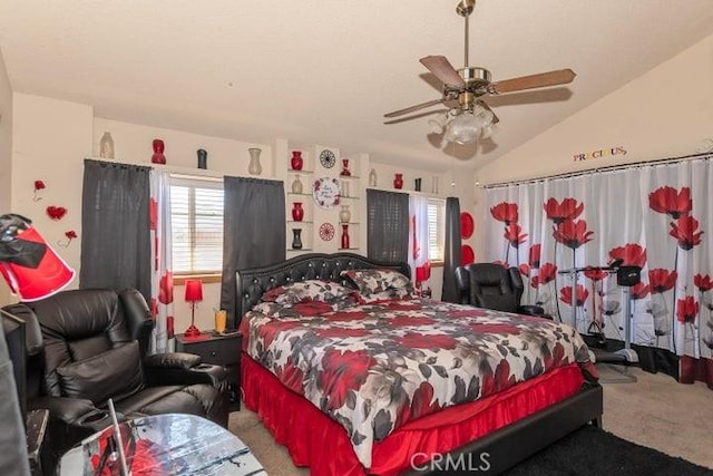 carpeted bedroom featuring lofted ceiling and ceiling fan