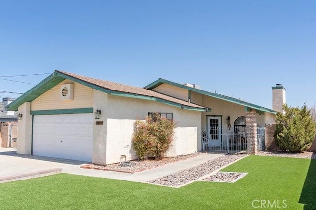 single story home featuring stucco siding, concrete driveway, a garage, and a front lawn