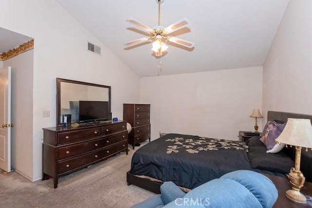 carpeted bedroom featuring lofted ceiling, visible vents, and a ceiling fan