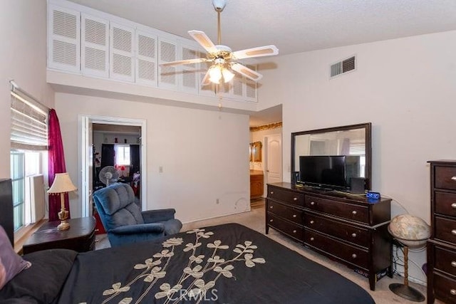 bedroom featuring visible vents, ceiling fan, and carpet
