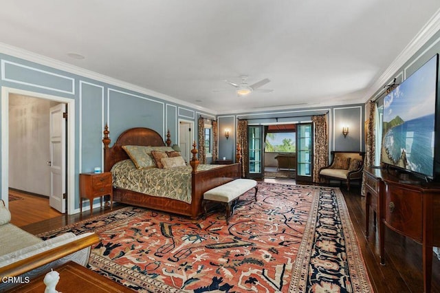 bedroom featuring access to outside, a decorative wall, crown molding, and wood finished floors