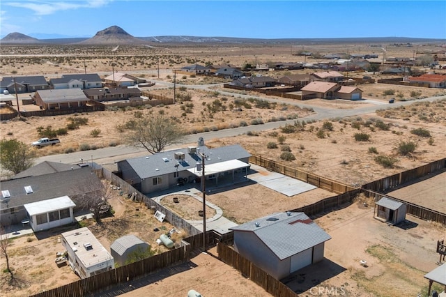 bird's eye view with a mountain view and view of desert
