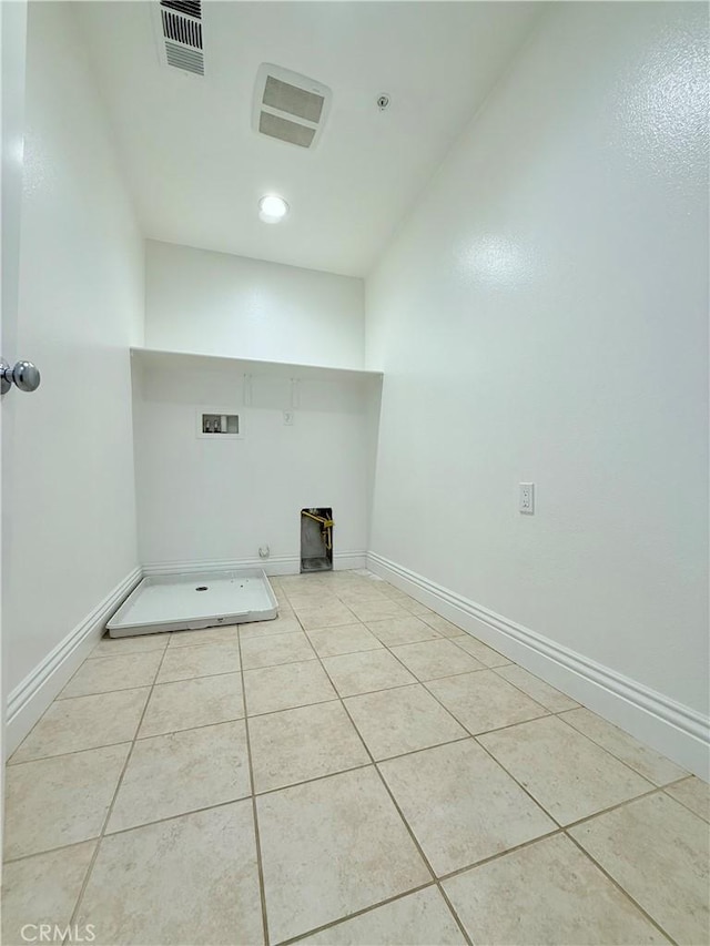 laundry room featuring washer hookup, visible vents, baseboards, light tile patterned flooring, and laundry area