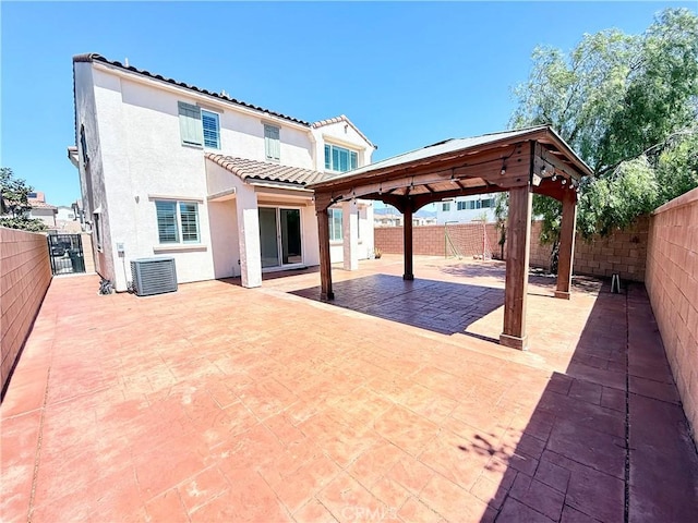 16977 Red Tail Ln, Fontana, CA 92336 - fenced backyard with a gazebo, a patio, and cooling unit