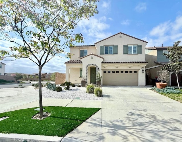 16977 Red Tail Ln, Fontana, CA 92336 - mediterranean / spanish house featuring stucco siding, driveway, an attached garage, and a tile roof