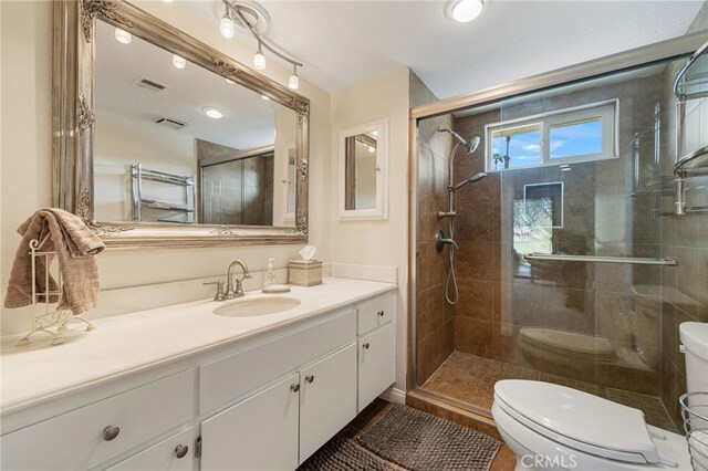 40310 Bay Hill Way, Palm Desert, CA 92211 - full bathroom with toilet, vanity, visible vents, and a shower stall