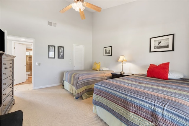 40310 Bay Hill Way, Palm Desert, CA 92211 - bedroom featuring light carpet, baseboards, visible vents, and a towering ceiling
