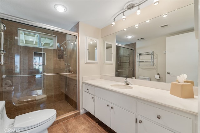 40310 Bay Hill Way, Palm Desert, CA 92211 - full bathroom featuring visible vents, a shower stall, toilet, tile patterned floors, and vanity