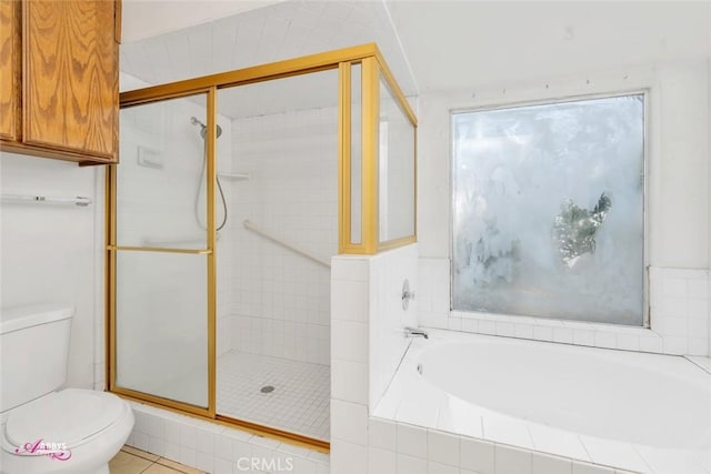 full bath featuring toilet, a bath, and a shower stall
