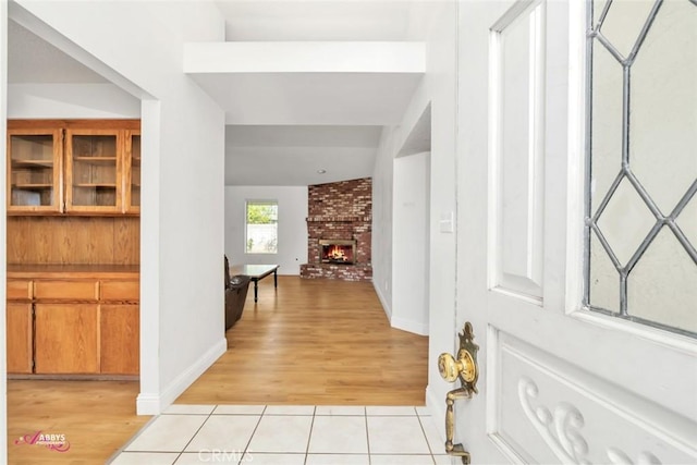 interior space with light tile patterned floors and baseboards