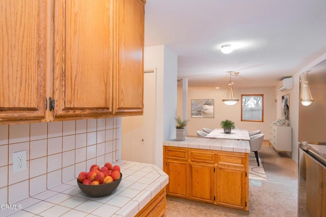 4558 Jessica Dr, Los Angeles, CA 90065 - kitchen featuring tasteful backsplash, tile countertops, a peninsula, and a wall mounted air conditioner