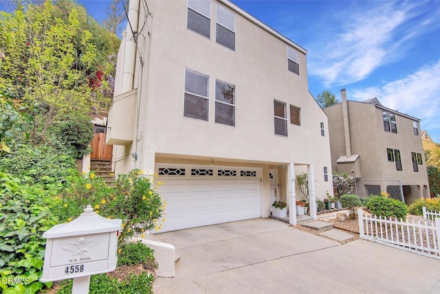 4558 Jessica Dr, Los Angeles, CA 90065 - view of front facade with fence, an attached garage, driveway, and stucco siding