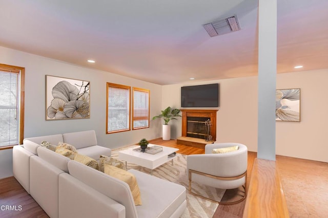 4558 Jessica Dr, Los Angeles, CA 90065 - living room featuring recessed lighting, visible vents, a glass covered fireplace, and wood finished floors