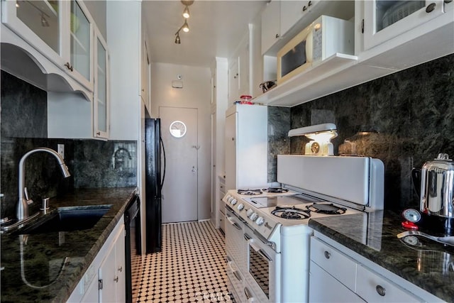 800 E Ocean Blvd Unit 1404, Long Beach, CA 90802 - kitchen featuring white cabinetry, decorative backsplash, glass insert cabinets, black appliances, and dark stone countertops