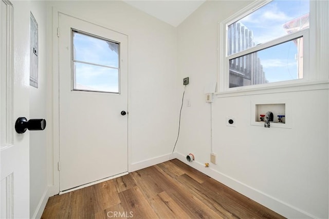 laundry room with washer hookup, wood finished floors, electric dryer hookup, laundry area, and baseboards