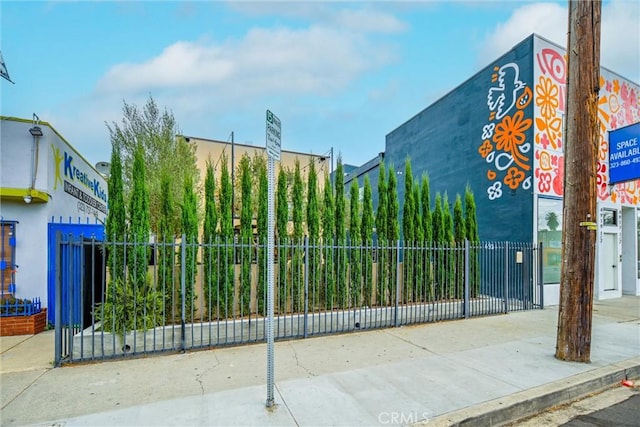 view of gate with fence