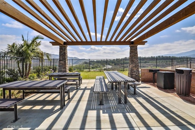 24307 Juni Ct, Corona, CA 92883 - fenced backyard with outdoor dining space, a mountain view, a pergola, and a patio
