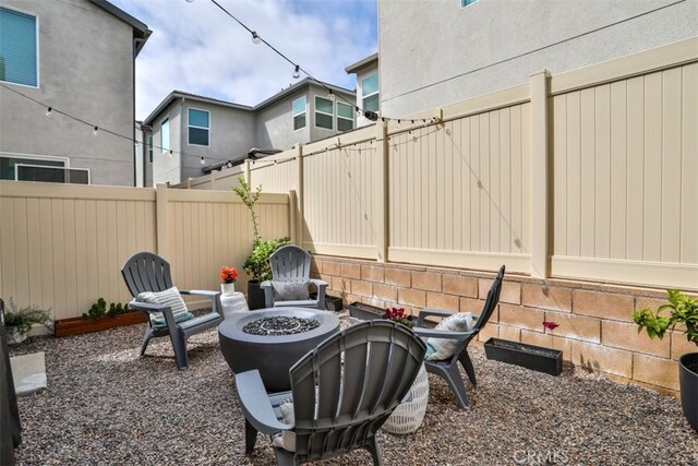 24307 Juni Ct, Corona, CA 92883 - fenced backyard with an outdoor fire pit