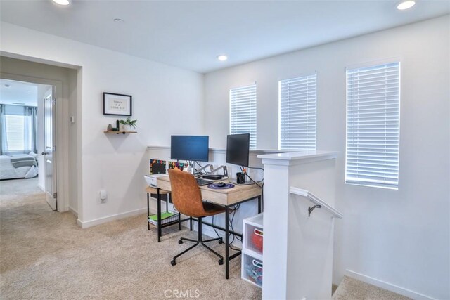carpeted office with recessed lighting and baseboards