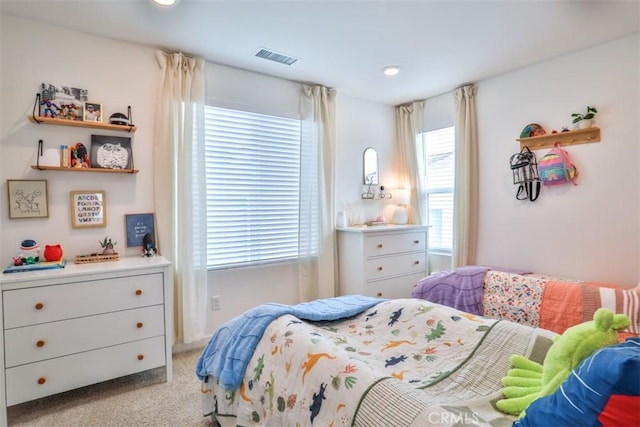 bedroom featuring recessed lighting, visible vents, and light carpet