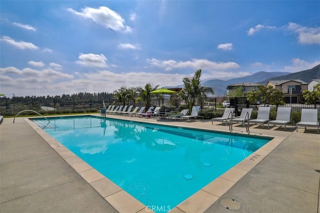 24307 Juni Ct, Corona, CA 92883 - community pool with a patio area and a mountain view