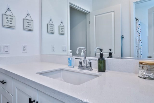 full bath with vanity and a shower with shower curtain
