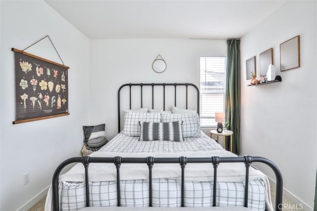 carpeted bedroom with baseboards