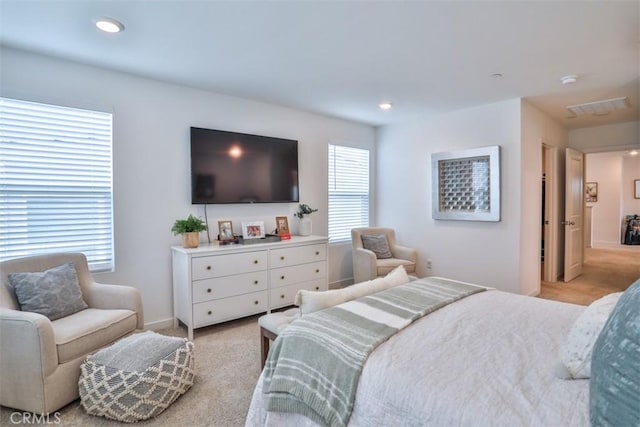 bedroom with recessed lighting, visible vents, light colored carpet, and baseboards