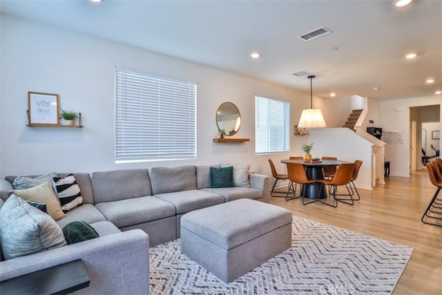 24307 Juni Ct, Corona, CA 92883 - living area with recessed lighting, stairs, light wood-style floors, and baseboards