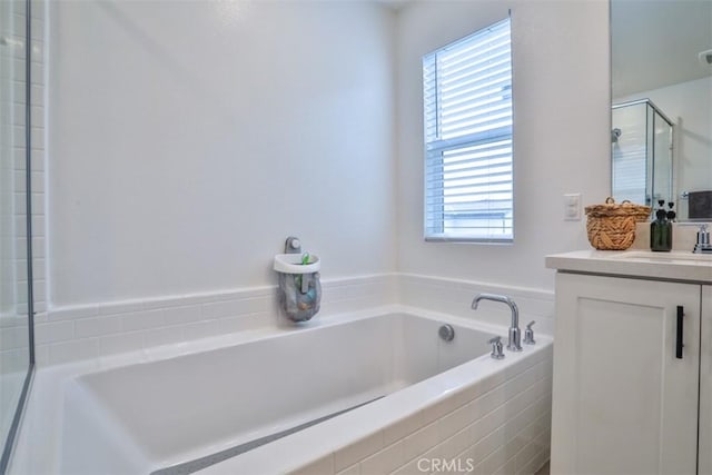 24307 Juni Ct, Corona, CA 92883 - bathroom featuring vanity, plenty of natural light, and a bath