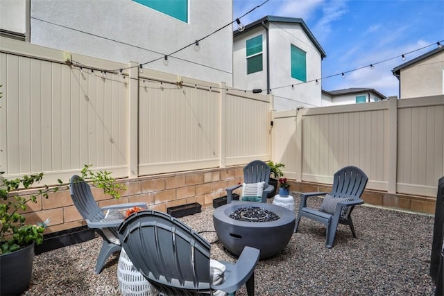24307 Juni Ct, Corona, CA 92883 - view of patio featuring a fire pit