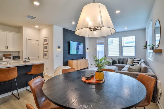 24307 Juni Ct, Corona, CA 92883 - dining area featuring light wood-style flooring, recessed lighting, and radiator heating unit