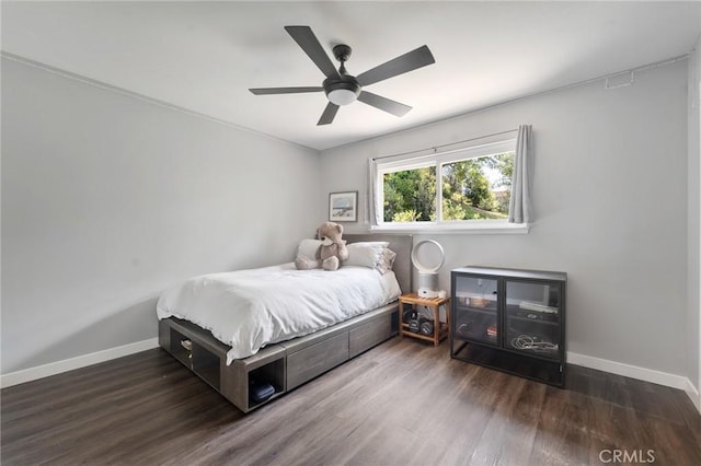 bedroom with baseboards, a ceiling fan, and wood finished floors