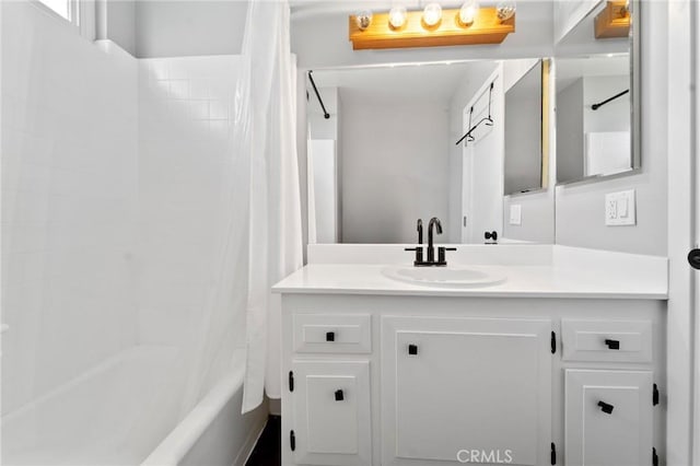 full bathroom featuring shower / bath combination with curtain and vanity