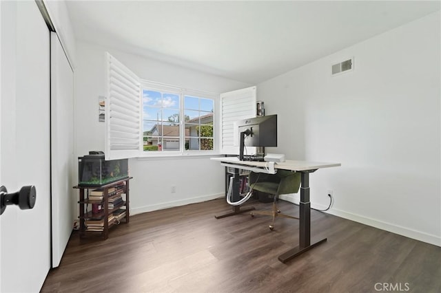 office with baseboards, wood finished floors, and visible vents