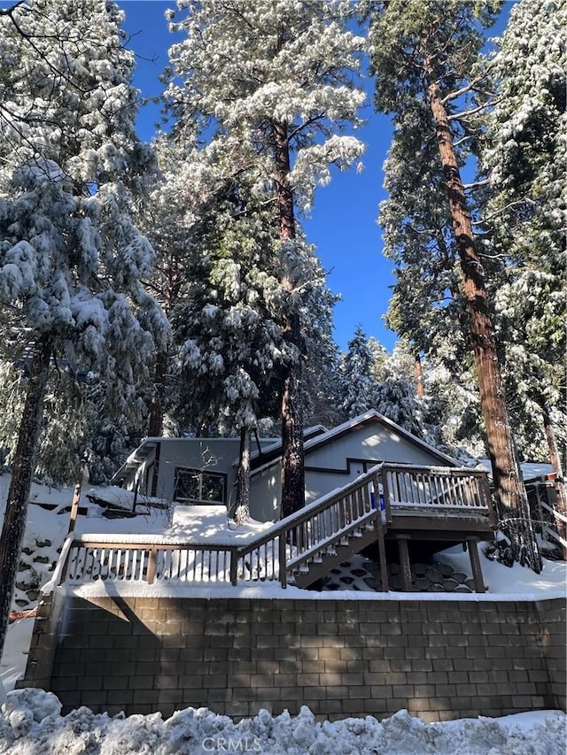 23817 Crest Forest Dr, Crestline, CA 92325 - snow covered rear of property featuring a wooden deck