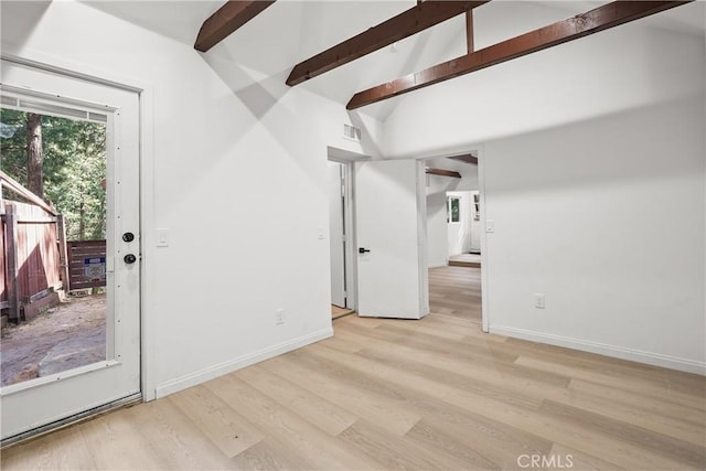 23817 Crest Forest Dr, Crestline, CA 92325 - empty room featuring light wood-style floors, baseboards, lofted ceiling with beams, and visible vents