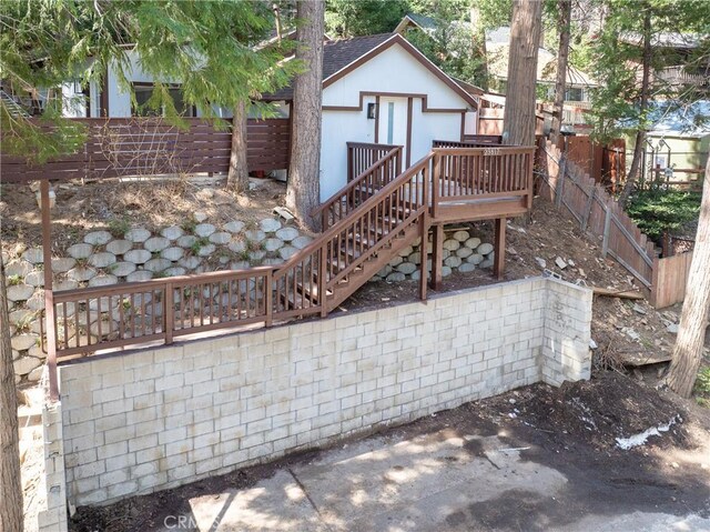 23817 Crest Forest Dr, Crestline, CA 92325 - rear view of property with a fenced backyard, a wooden deck, stairway, and a shingled roof