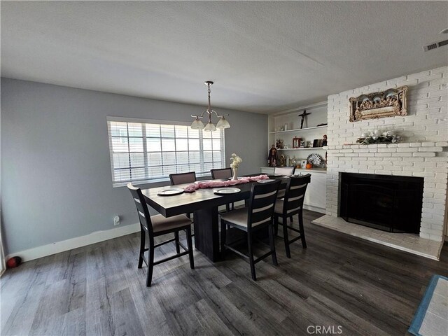 13305 Cordary Ave, Hawthorne, CA 90250 - dining area featuring baseboards, a chandelier, dark wood-type flooring, and a textured ceiling