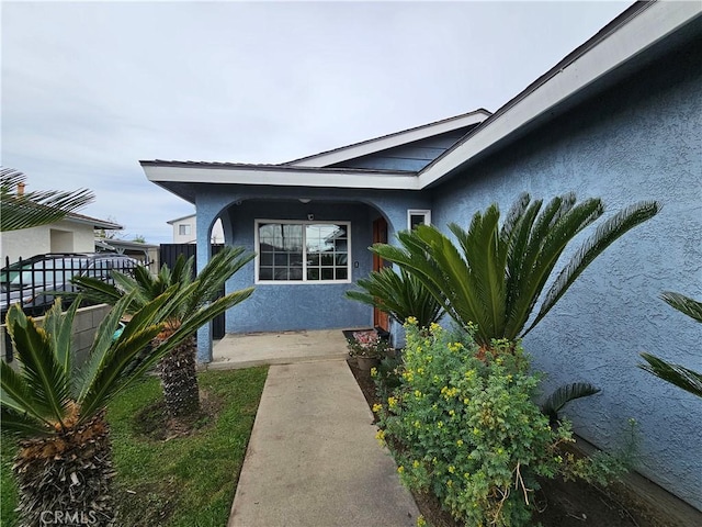 13305 Cordary Ave, Hawthorne, CA 90250 - view of exterior entry with stucco siding and a porch