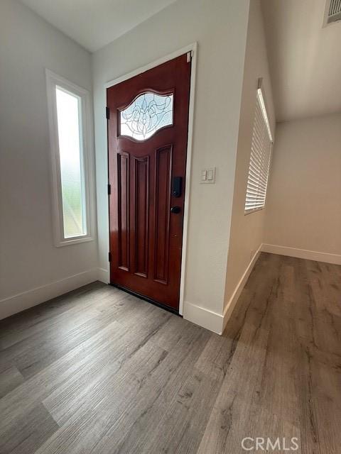 13305 Cordary Ave, Hawthorne, CA 90250 - foyer entrance featuring wood finished floors and baseboards