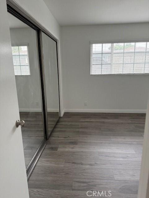 13305 Cordary Ave, Hawthorne, CA 90250 - unfurnished bedroom featuring a closet and wood finished floors