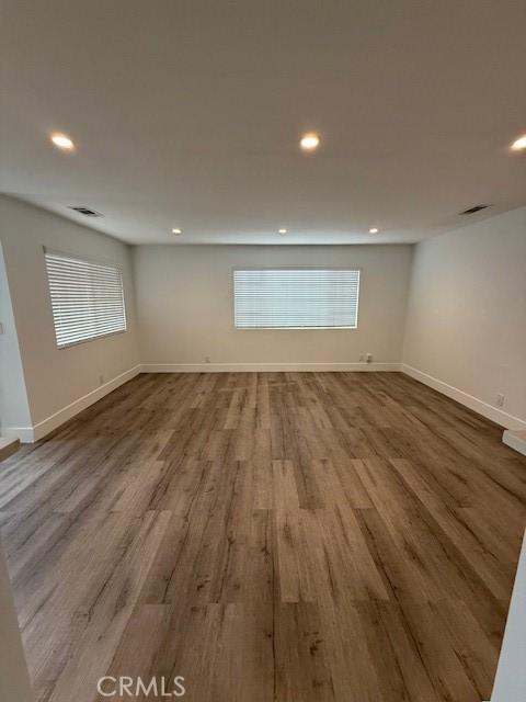 13305 Cordary Ave, Hawthorne, CA 90250 - spare room with recessed lighting, healthy amount of natural light, and wood finished floors