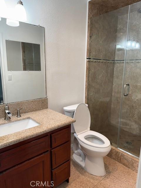 13305 Cordary Ave, Hawthorne, CA 90250 - full bathroom with vanity, a stall shower, and tile patterned floors