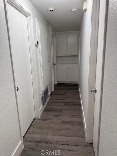 13305 Cordary Ave, Hawthorne, CA 90250 - hall featuring dark wood-style flooring and baseboards