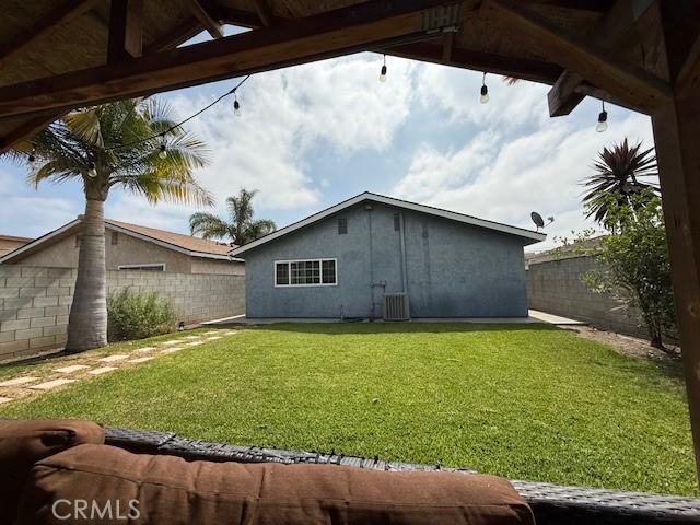 13305 Cordary Ave, Hawthorne, CA 90250 - rear view of house featuring a fenced backyard and a gazebo