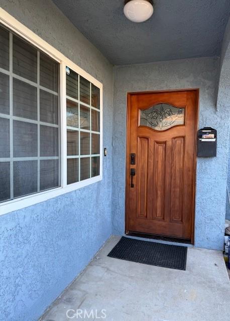 13305 Cordary Ave, Hawthorne, CA 90250 - property entrance with stucco siding and covered porch